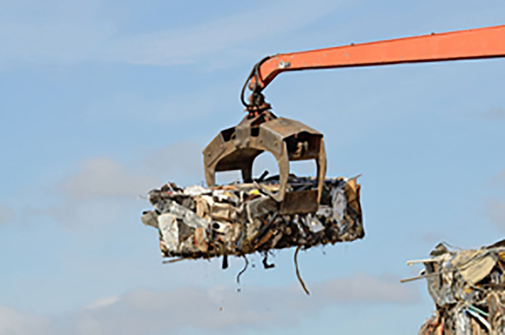 Excavator Moving Scrap Metal At Mryglod Steel Scrapyard With Piles Of Metal Debris